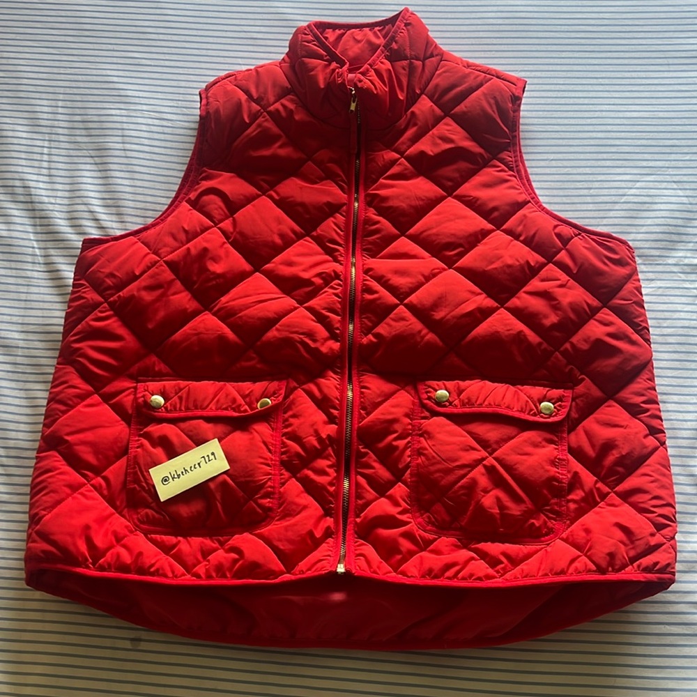 puffy red vest with gold accents